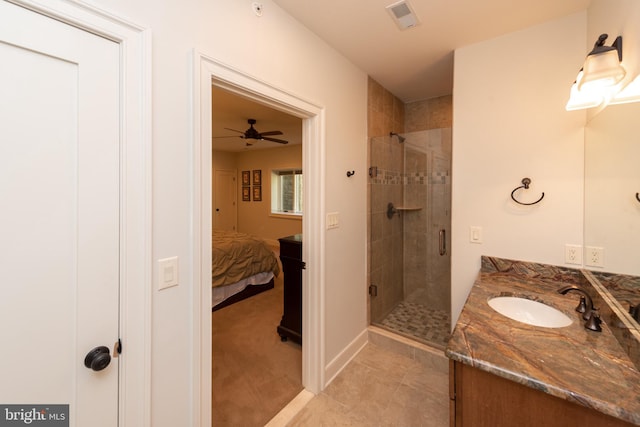 bathroom featuring vanity, an enclosed shower, tile flooring, and ceiling fan