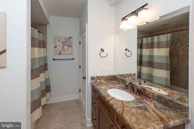 bathroom featuring tile floors and large vanity