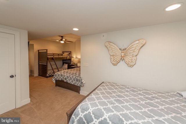 bedroom with light carpet and ceiling fan