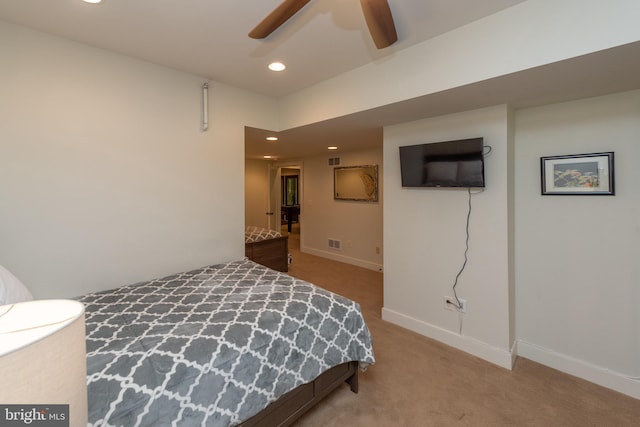 bedroom featuring ceiling fan and light carpet