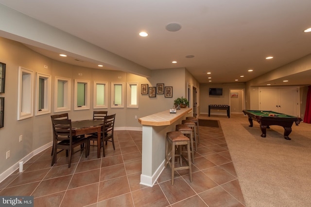 rec room with dark tile floors and billiards