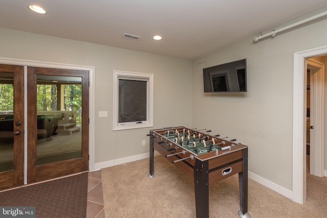 playroom featuring light tile floors