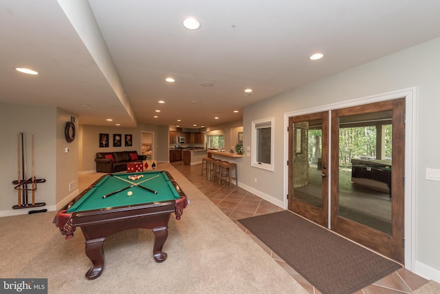 recreation room with light colored carpet and billiards