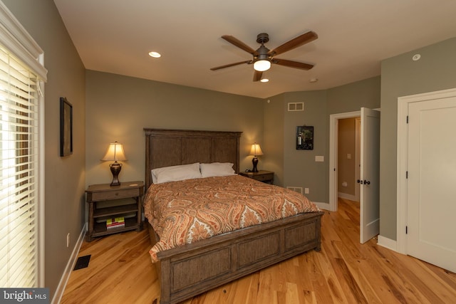 bedroom featuring light hardwood / wood-style floors and ceiling fan