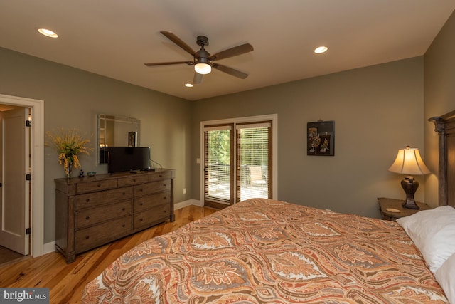 bedroom with light hardwood / wood-style floors, ceiling fan, and access to outside