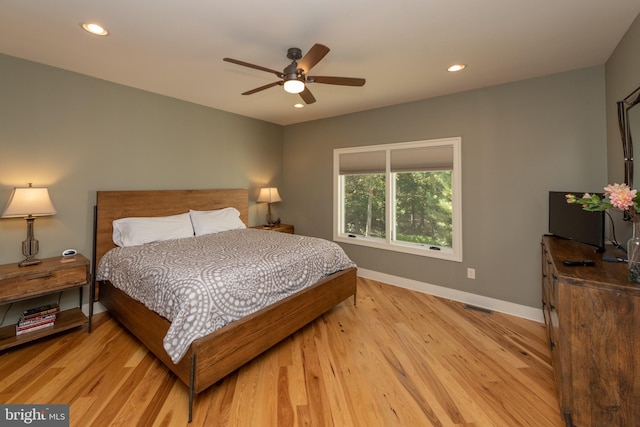 bedroom featuring light hardwood / wood-style flooring and ceiling fan