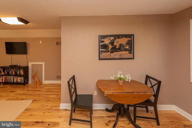 dining space featuring light hardwood / wood-style floors