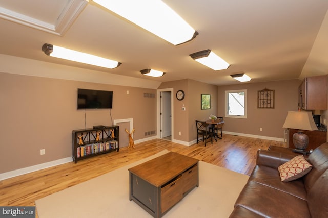 living room with light hardwood / wood-style flooring