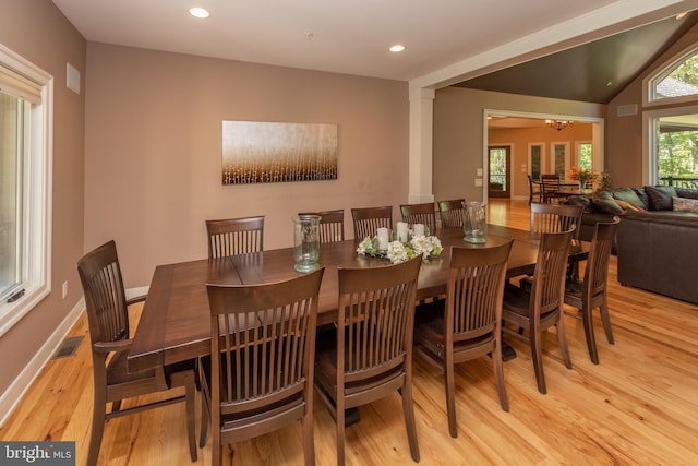 dining space featuring lofted ceiling, light hardwood / wood-style floors, and ceiling fan