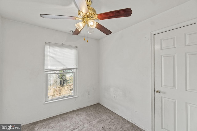 carpeted empty room with ceiling fan