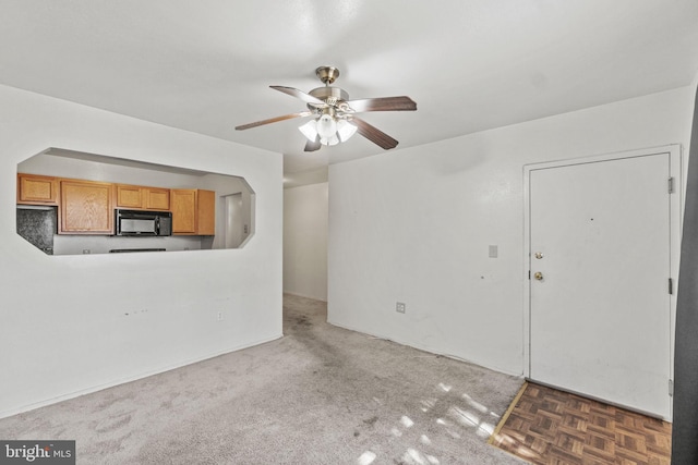 empty room with parquet flooring and ceiling fan