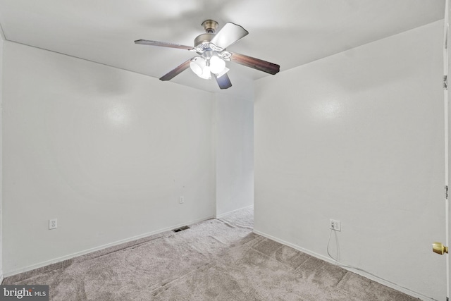 unfurnished room with light colored carpet and ceiling fan