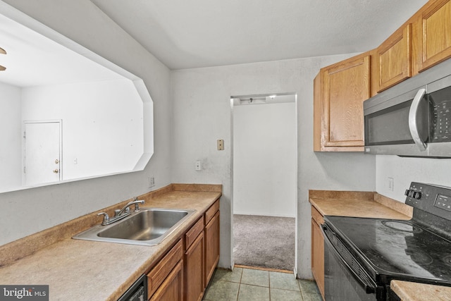 kitchen featuring sink, black electric range oven, and light tile floors