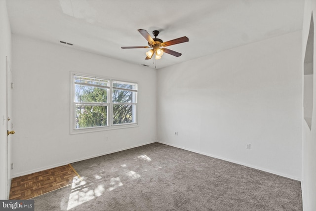 carpeted empty room with ceiling fan