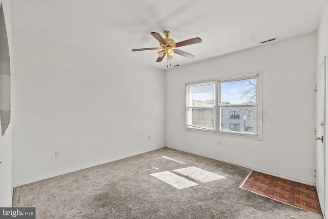 carpeted empty room with ceiling fan