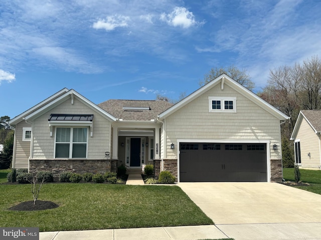 view of front of property with a garage and a front yard