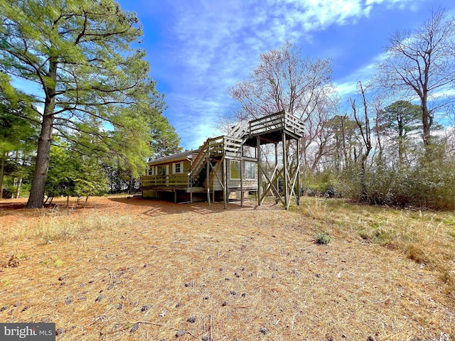 view of yard with a wooden deck