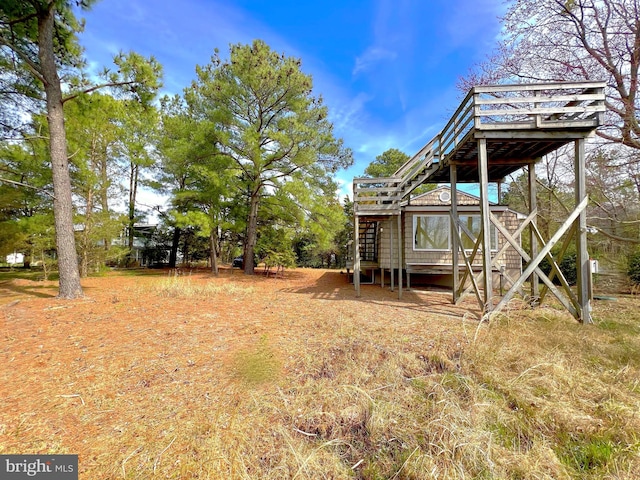 view of yard featuring a wooden deck