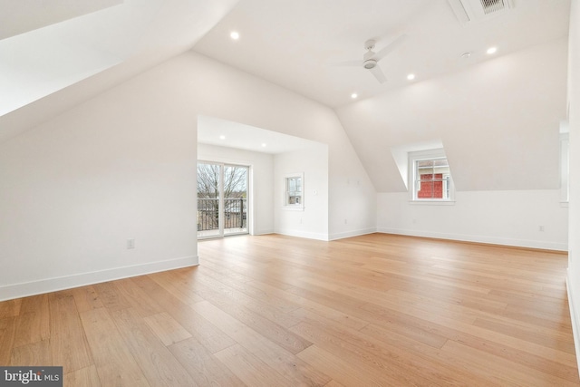 additional living space with lofted ceiling, baseboards, light wood-type flooring, recessed lighting, and a ceiling fan