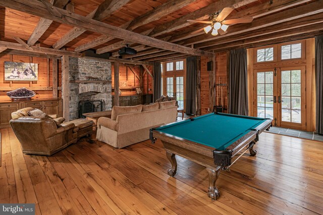 playroom featuring french doors, light wood-type flooring, a fireplace, and billiards