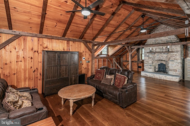 unfurnished living room featuring a fireplace, vaulted ceiling with beams, wood ceiling, dark wood-type flooring, and wood walls