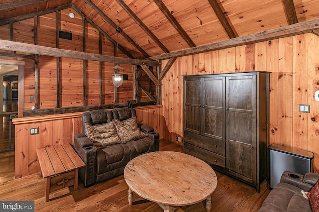 living room with wood ceiling, hardwood / wood-style floors, and wood walls