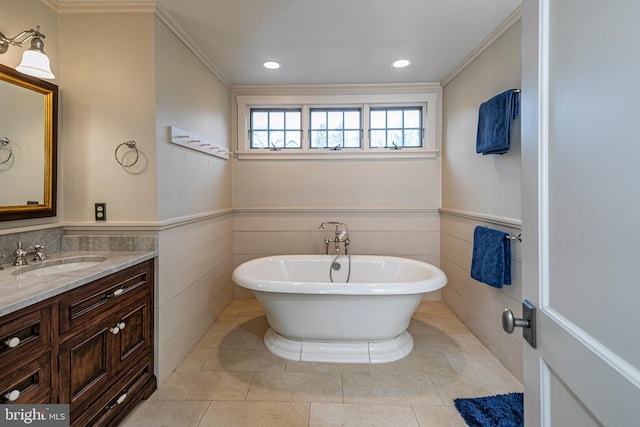 bathroom with tile walls, ornamental molding, tile flooring, and vanity