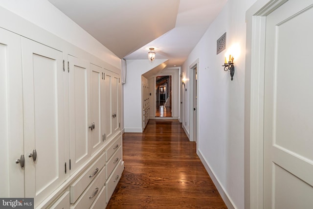 hallway featuring dark wood-type flooring