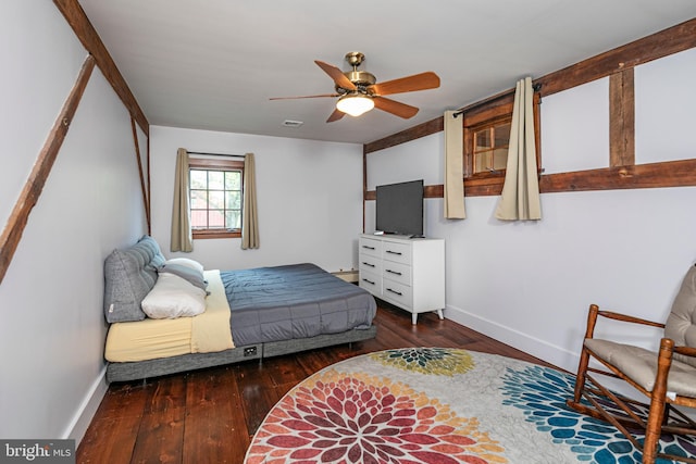 bedroom with ceiling fan and dark hardwood / wood-style floors