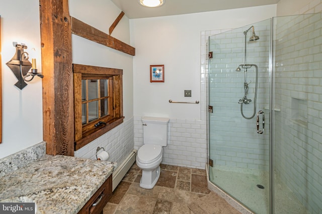 bathroom featuring walk in shower, tile floors, toilet, vanity, and baseboard heating