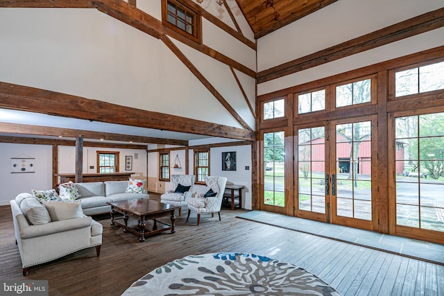 living room featuring high vaulted ceiling, hardwood / wood-style floors, french doors, and beamed ceiling