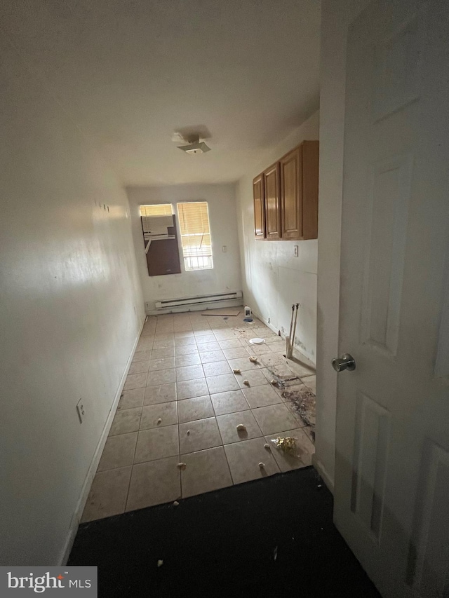 interior space featuring light tile flooring and a baseboard radiator