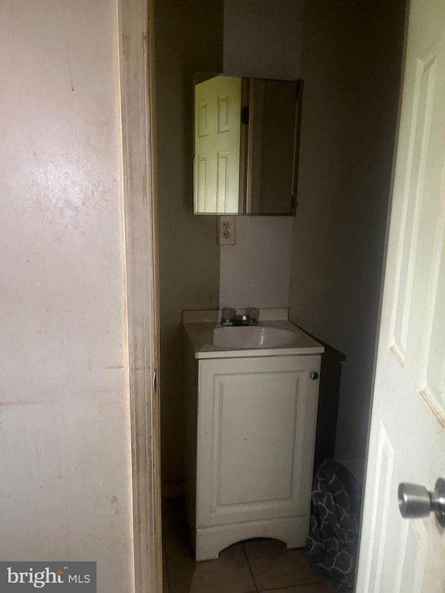 bathroom featuring vanity and tile flooring