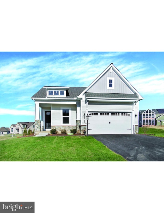 craftsman-style house with a garage and a front yard