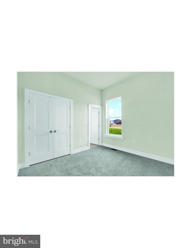 unfurnished bedroom with light carpet