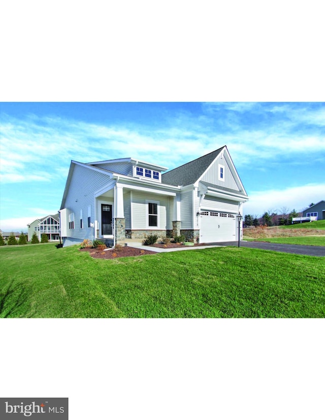 view of front of home featuring a garage and a front lawn