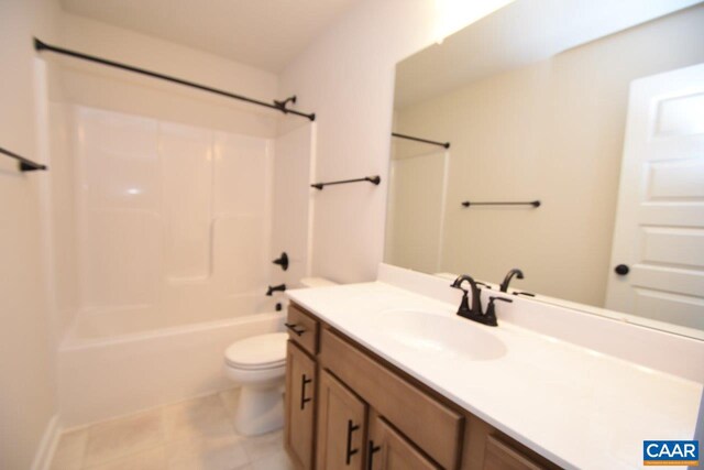 full bathroom with shower / bath combination, tile patterned floors, toilet, and vanity