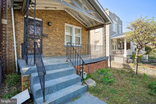 property entrance featuring covered porch