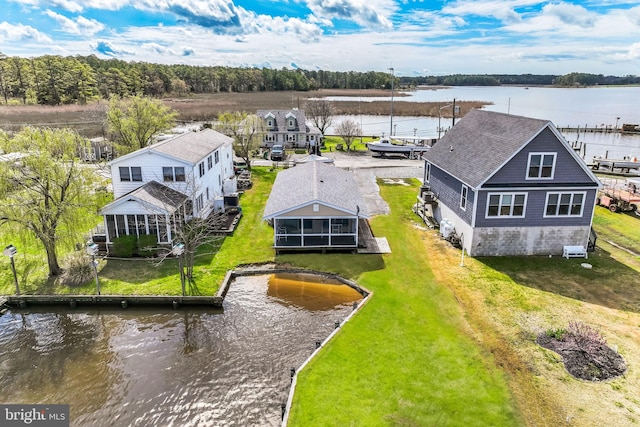 drone / aerial view with a water view