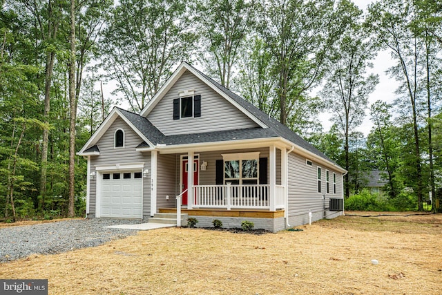 view of front facade featuring a garage, central AC unit, and a porch