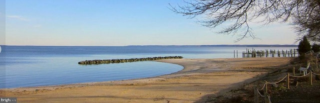 property view of water featuring a beach view