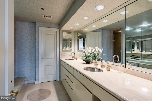 bathroom featuring tile flooring and dual vanity