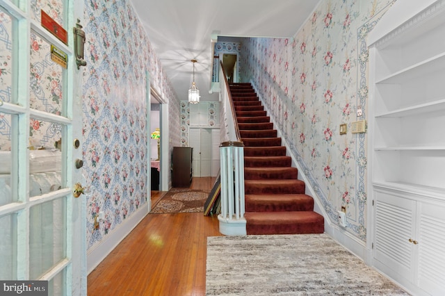 staircase with light wood-type flooring