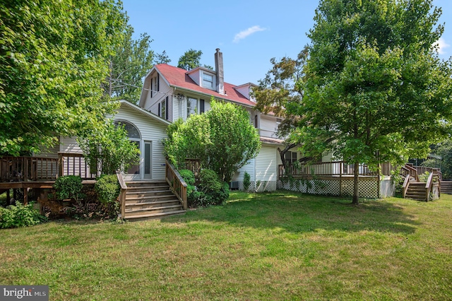 view of yard featuring a wooden deck