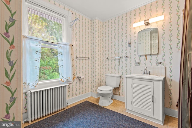 bathroom featuring vanity, toilet, radiator, and crown molding