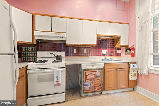 kitchen featuring light tile floors, white cabinets, sink, white appliances, and backsplash