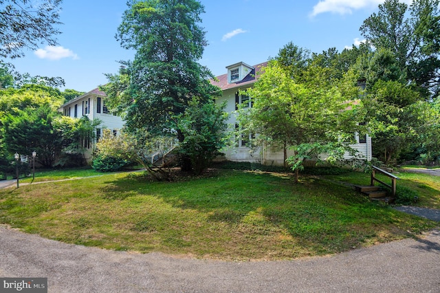 view of front of home with a front yard