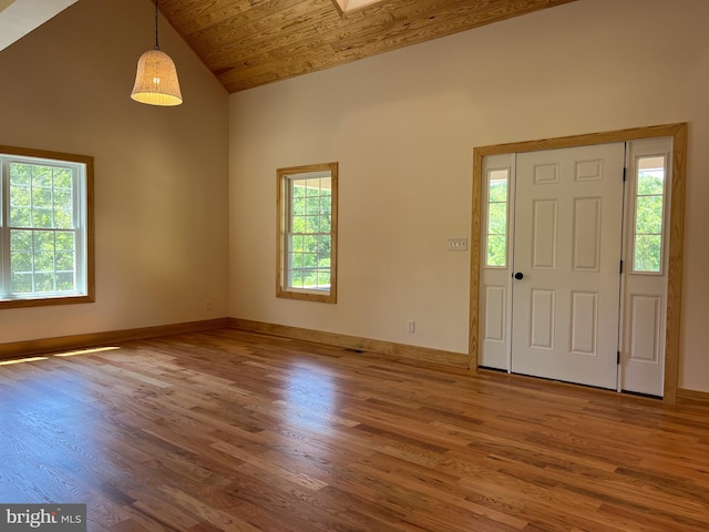 foyer entrance with high vaulted ceiling, wood ceiling, and hardwood / wood-style flooring