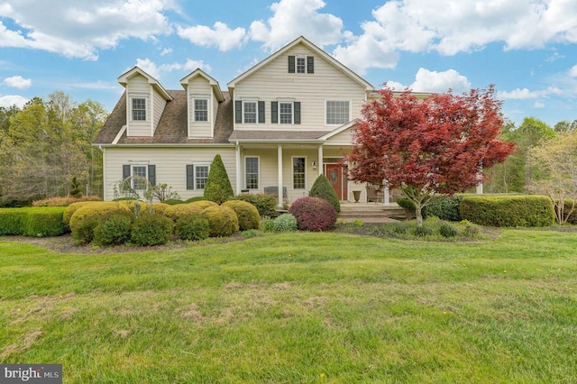 view of front facade with a porch and a front lawn