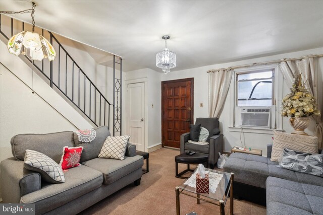 living room with carpet floors and a chandelier